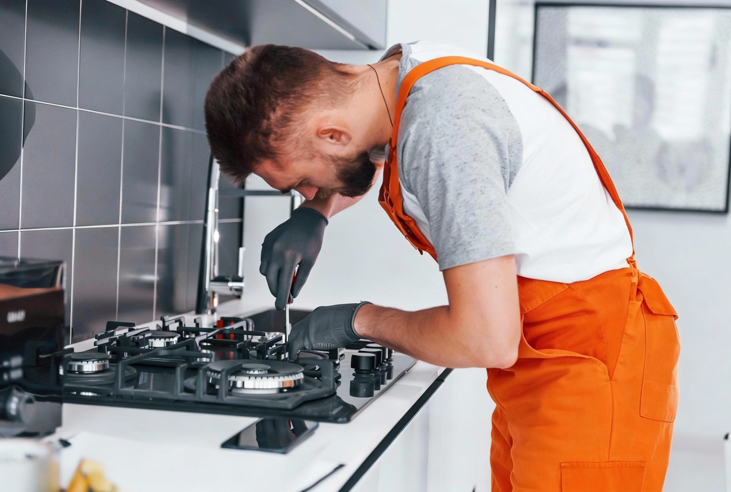 Gas cooktop burner repair and maintenance service performed by Appliance Pro Dallas technician